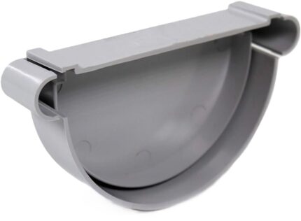 A light gray gutter end cap on a white background. This fitting is designed to cap off the end of a semi-circular gutter and has a smooth, curved shape with a small tab for connecting to the gutter's lip. The inside of the end cap is visible.