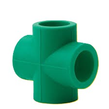 A green PPR cross tee, a plumbing fitting used to connect four pipes at a single point to split a water line into three separate branch lines.