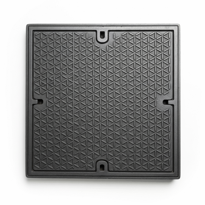 A plain grey square manhole cover with a raised geometric texture, on a white background.
