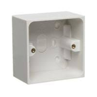 A white, rectangular deep pattress box, an electrical surface mounting box, with two brass screw terminals visible inside.