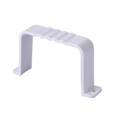 A single, white plastic PTG downpipe clip on a white background. The clip has a wide, U-shaped body with a ribbed top and two flat mounting flanges at the base. It is used to hold a downpipe against a wall.