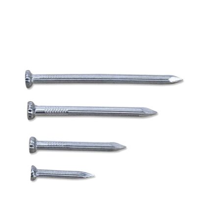 Four shiny silver steel nails with flat, ridged heads and pointed tips, lying diagonally on a white surface.